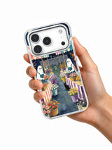 The Ghost Flower Market Before Dawn iPhone case held in hand