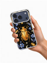 Hand holding a clear iPhone case printed with Golden Beetle Night art