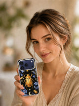 Lifestyle view of a woman holding the Golden Beetle Night iPhone case