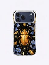Golden beetle iPhone case pattern with indigo flowers, crescent moon, stars, and black background
