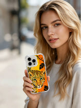 Lifestyle view of Golden Jungle Guardian iPhone 13 Pro Max case with black tropical leaf accents