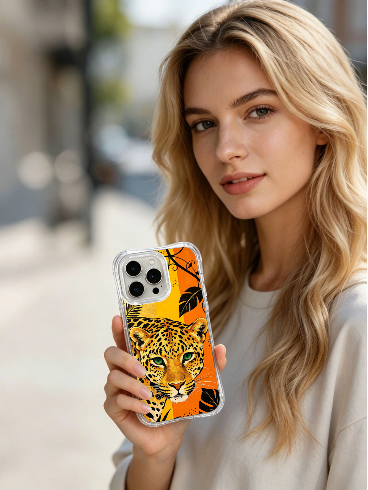 Lifestyle view of Golden Jungle Guardian iPhone 13 Pro Max case with black tropical leaf accents
