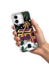 The Golden Key and the Gift Chest iPhone 17 case held in hand