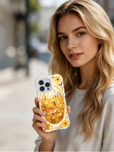 Golden Meadow Rabbit: A person holding the illustrated case outdoors.
