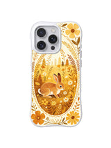 Golden Meadow Rabbit / Golden Nest Rabbit: A brown rabbit inside a golden oval meadow framed by tall stems and yellow flowers.