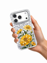 Hand holding the Golden Turning iPhone 17 Pro case with mustard zinnia artwork