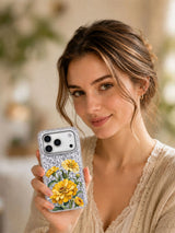 Lifestyle portrait with the Golden Turning iPhone 17 Pro case featuring golden zinnias