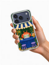 Tea Beneath the Green Awning transparent case held in hand for iPhone 17 Pro