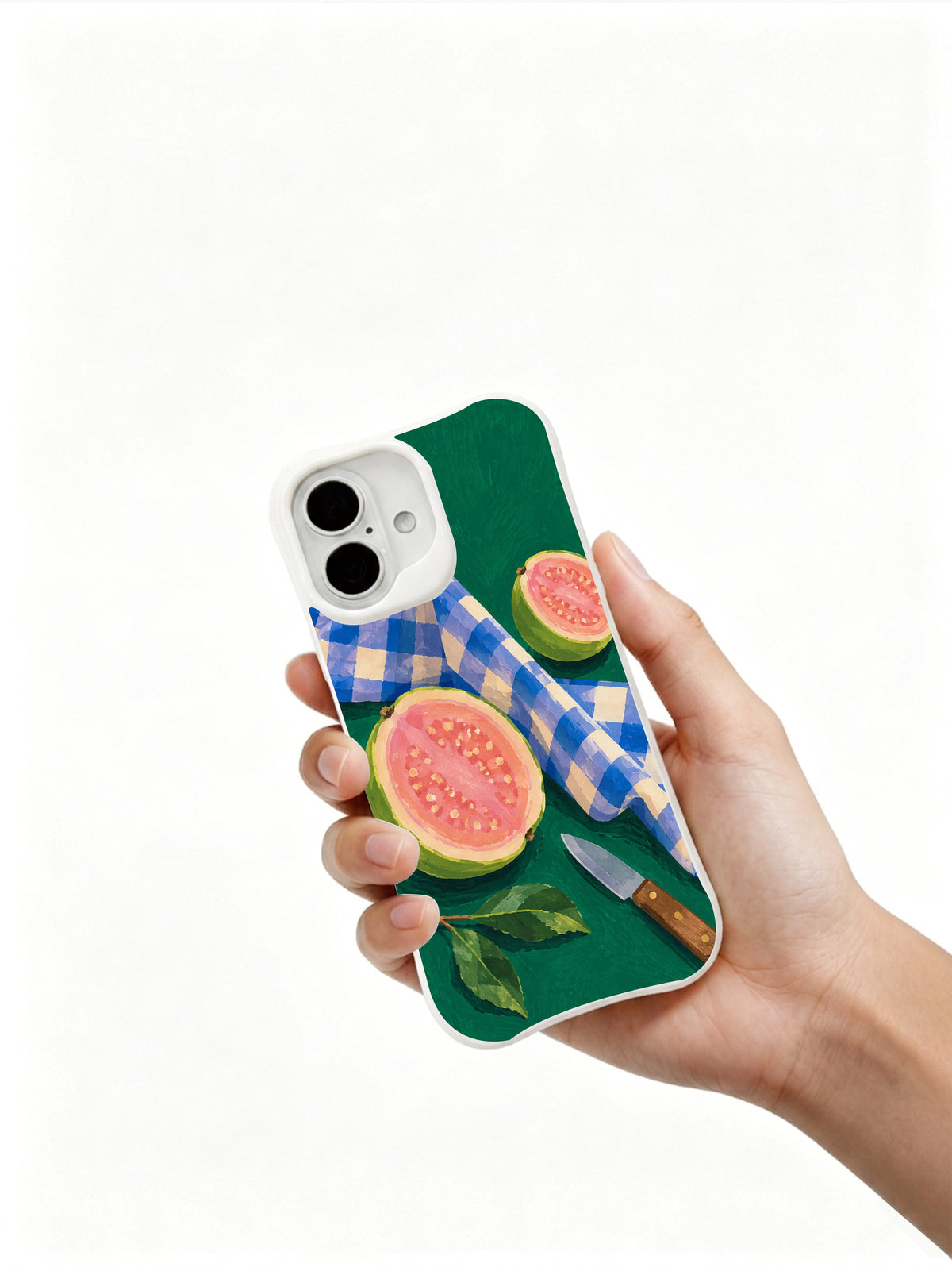 Guava Picnic Fold iPhone 16 case held in hand