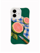 Pink Halves guava and gingham artwork on an iPhone 16 case