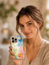 Happy Planet Playground colorful planet case held in lifestyle scene