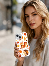 Harvest Friends Parade: Person holding the illustrated case outdoors.