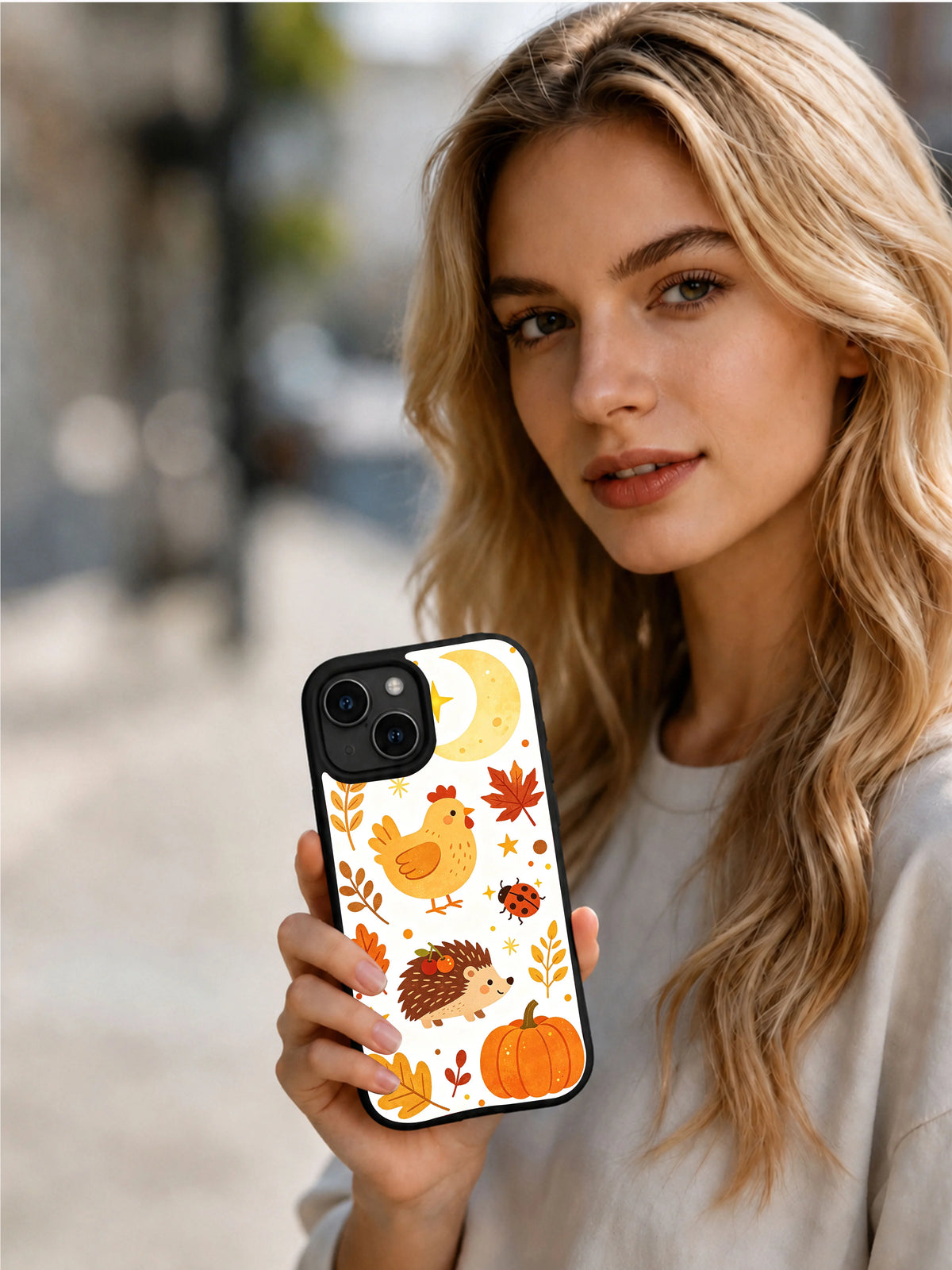 Harvest Moon Chickens: Person holding the illustrated case in an outdoor portrait.