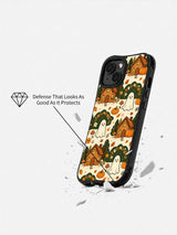 Haunted Cozy Cottage iPhone 14 case shown in a drop demonstration