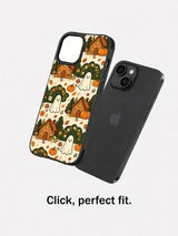 Haunted Cozy Cottage iPhone 14 case shown beside the phone for fit