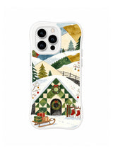 Checkerboard valley gate with wreath and snowy hills on a white iPhone 16 Pro case