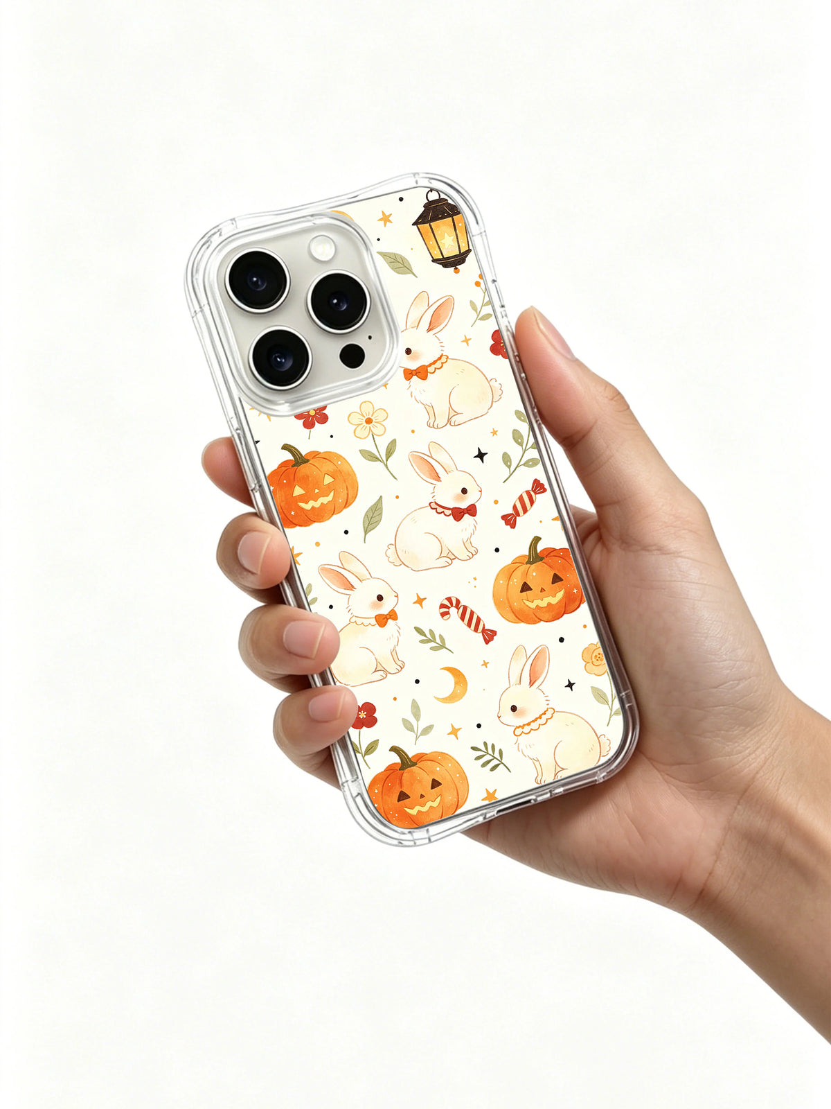 Lantern Bunny Trick Night iPhone 14 Pro case held in hand