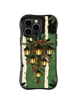 Lantern Grove Cascade pattern on a black iPhone 14 Pro case with clustered hanging lanterns, pine sprigs, red berries, gold stars and ivory tree bands