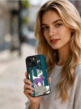 Person holding the Lavender Lynx Forest black iPhone 13 case outdoors