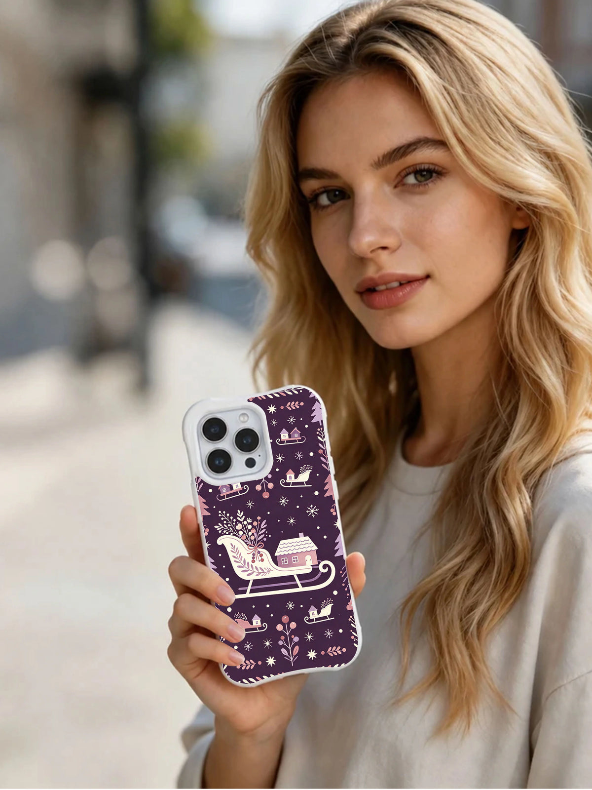Lifestyle view of Lavender Sleighflower Woods iPhone 13 Pro case with winged floral sled and purple pattern