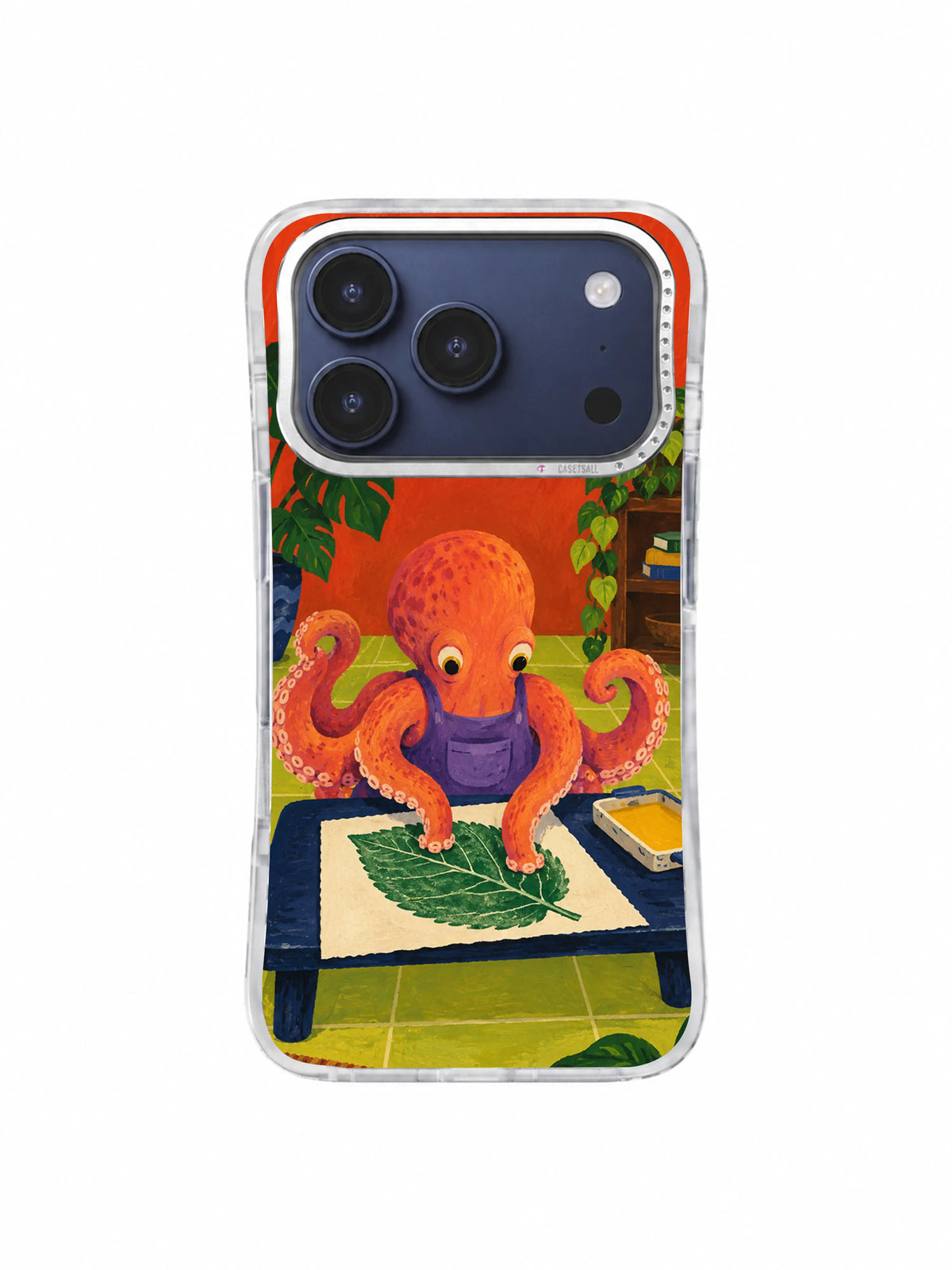 Octopus aligning a giant mint leaf on a navy print table on an iPhone 17 Pro case