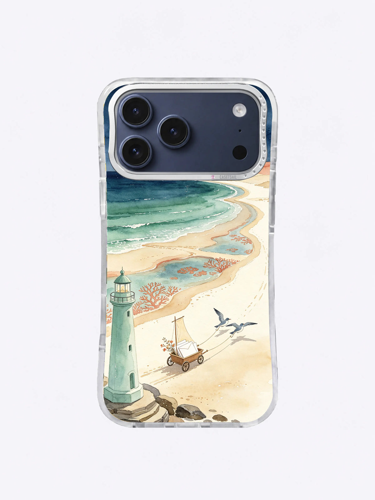 Coral Tide Sand Road artwork on an iPhone 17 Pro Max case with seafoam water bands, a lighthouse, and coastal birds