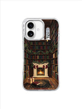 Dark academia iPhone 17 case with a golden star bookmark beside a Christmas fireplace