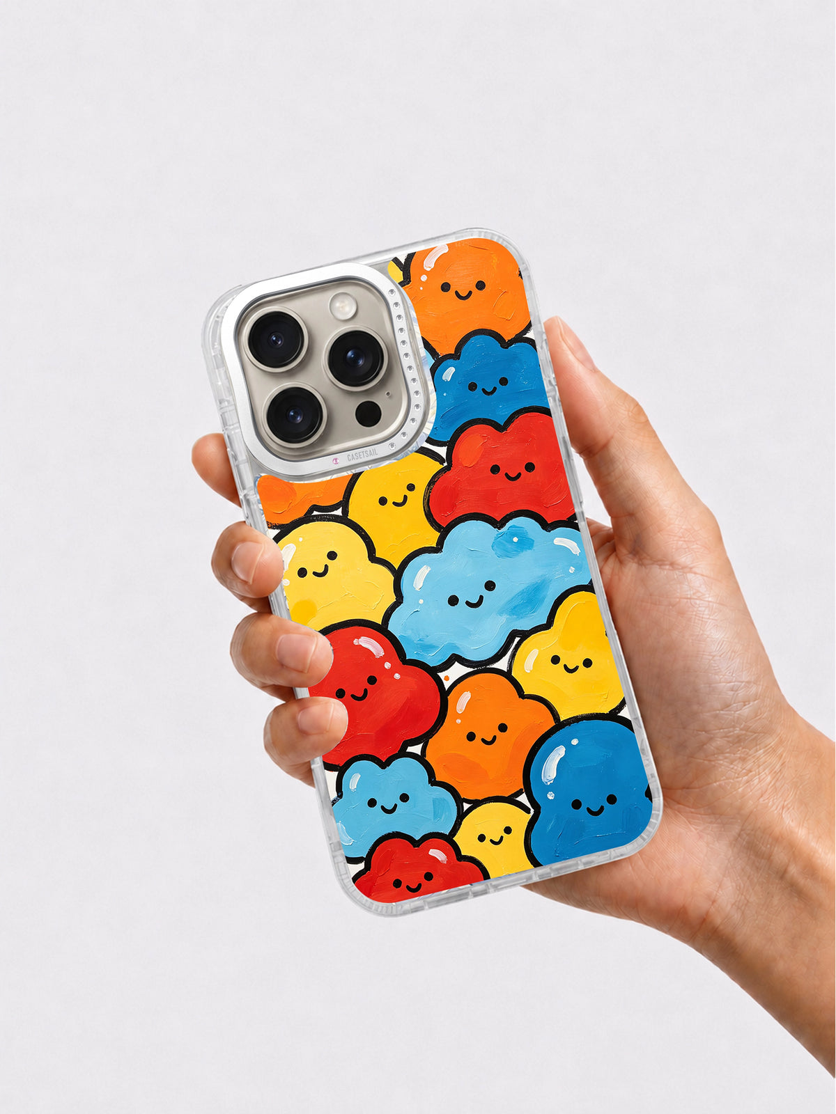 Happy Little Shapes iPhone 16 Pro Max case in hand