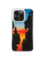 Black canyon silhouettes with orange blue sunset artwork for iPhone 16 Pro Max case
