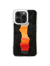 Narrow black canyon framing orange red sunset artwork for iPhone 16 Pro Max case