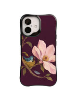 Deep mulberry floral phone case pattern with magnolia sheltering a woven bird nest
