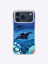 Midnight manta rays gliding through constellation-like ocean patterns on an iPhone case