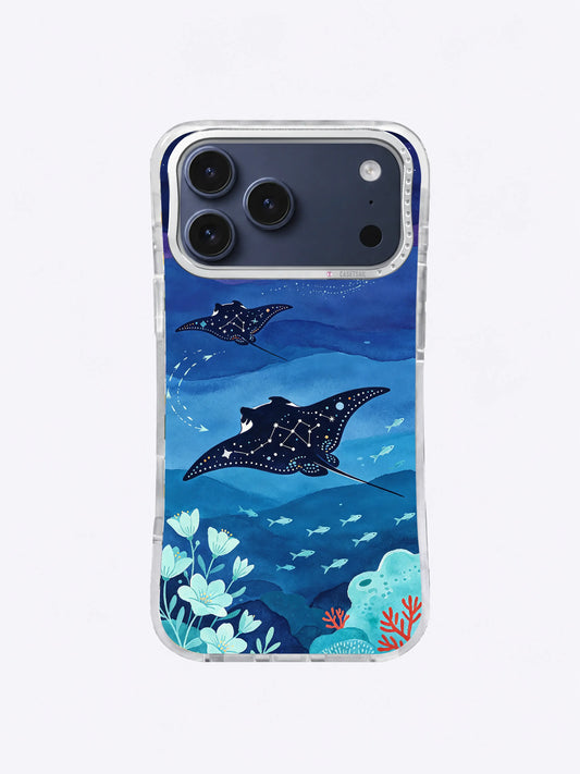 Midnight manta rays gliding through constellation-like ocean patterns on an iPhone case