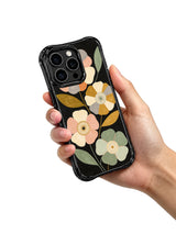 Midnight botanical art iPhone 15 Pro case in hand