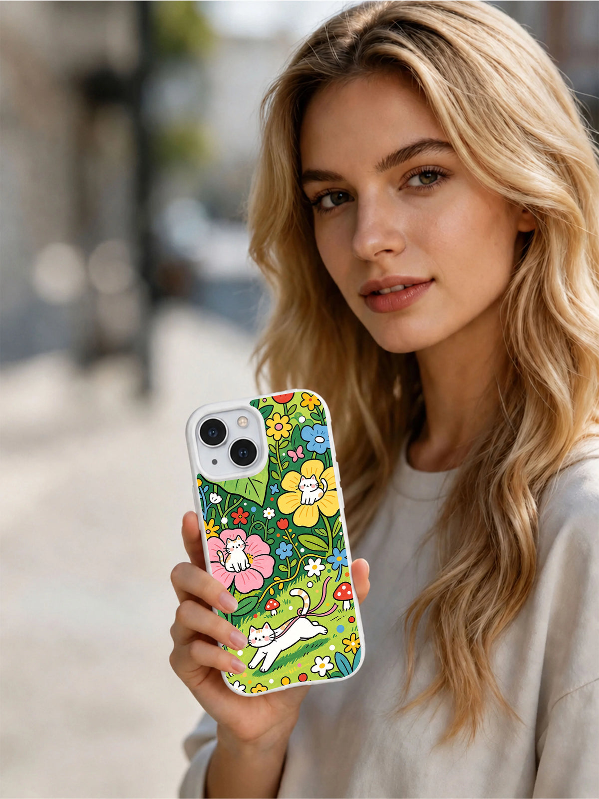 Artist-designed garden cat phone case display
