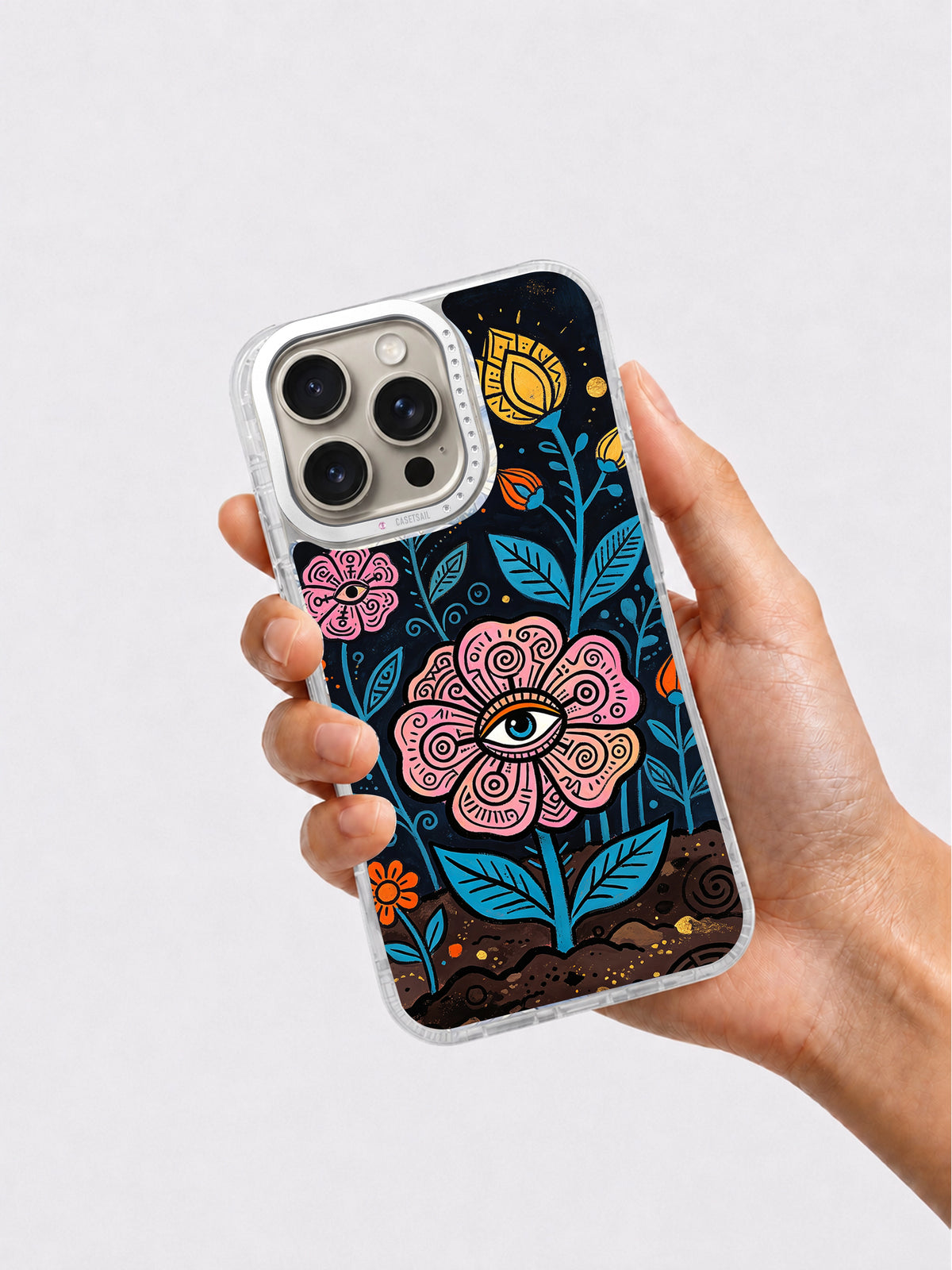 Dark botanical eye phone case held in hand