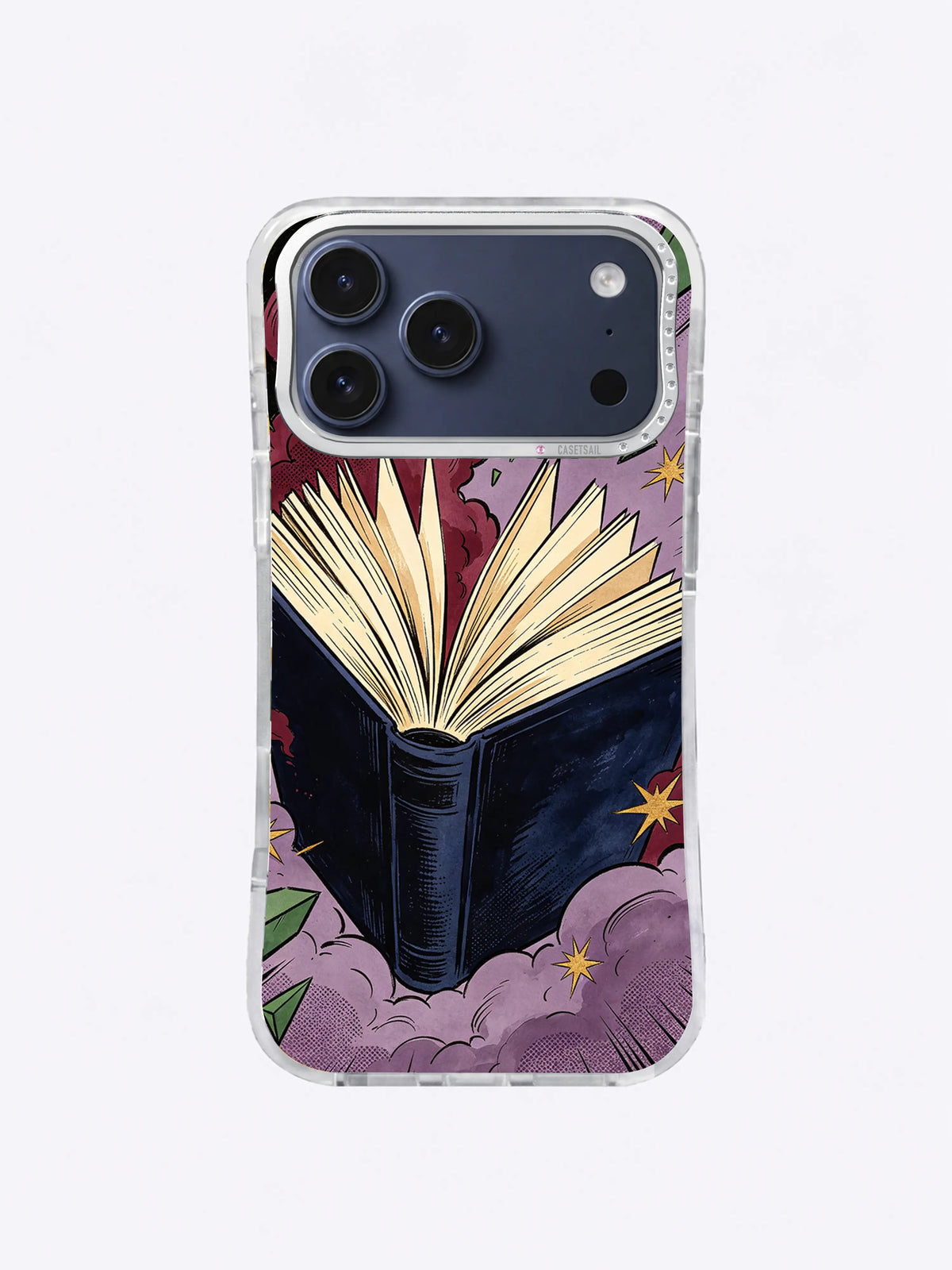 Midnight Book Burst iPhone case with an open navy book, fanned cream pages, burgundy rays, lavender clouds, green shards, and gold stars