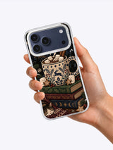 In-hand product view of Midnight Cocoa Club artwork on an iPhone 17 Pro Max case