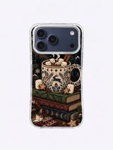 Midnight Cocoa Club iPhone case with a blue floral mug, smiling marshmallows, stacked books, stars, leaves and curling steam