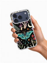 Hand-held phone-case view showing The Midnight Naturalist teal moth, mushroom, fern, moon, and flower artwork