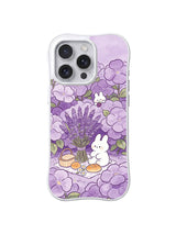 Lavender Bouquet Story Picnic: Three rabbits gather around a small picnic beneath purple blossoms.
