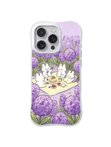 Purple Bloom Bunny Gathering: Rabbits gather around a picnic framed by hydrangeas and lavender flowers.