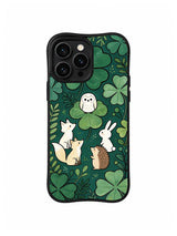 Woodland Clover Council: An owl, fox, deer, rabbit and hedgehog gather among dark green clover leaves.
