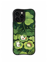 Clover Leaf Resting Friends: A rabbit and hedgehog rest inside layers of large green clover leaves.