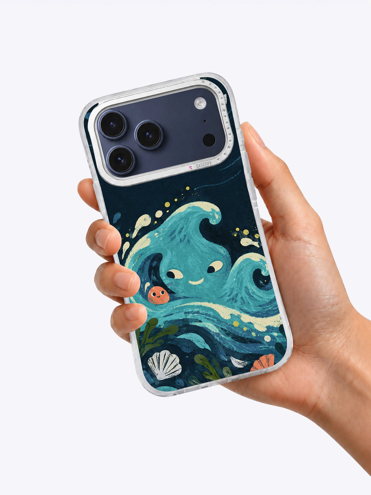 Hand holding The Tide with Mismatched Eyes iPhone 17 Pro Max case