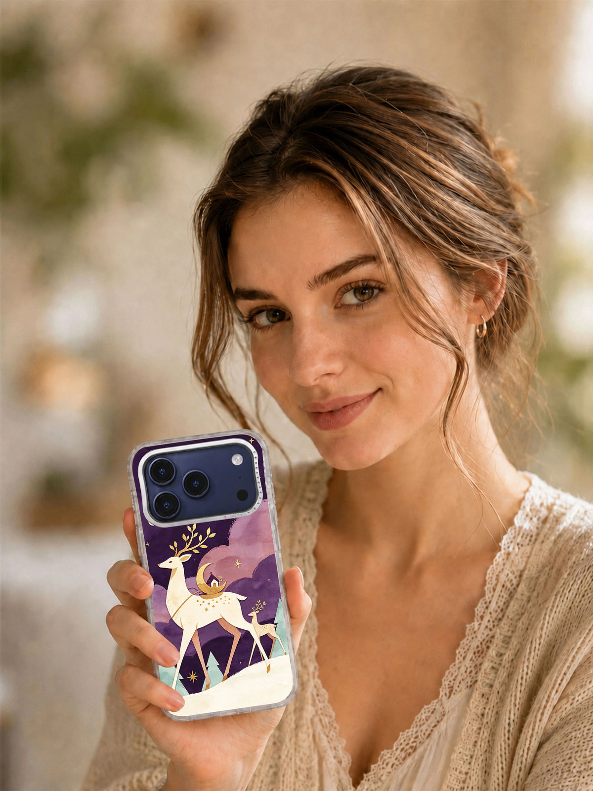 Lifestyle view of a person holding the Moon-Deer Passage iPhone 17 Pro Max case