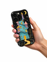 Moonkeeper’s Crooked Tower: A hand holding the illustrated case.