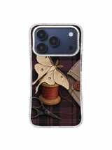 Moth at the Missing Button iPhone 17 Pro Case pattern 3 with ivory moth, sewing tools and vintage checks