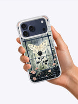 Hand holding The Moth Conservatory iPhone case
