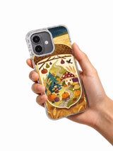 Mushroom Witch’s Harvest Night iPhone case held in hand